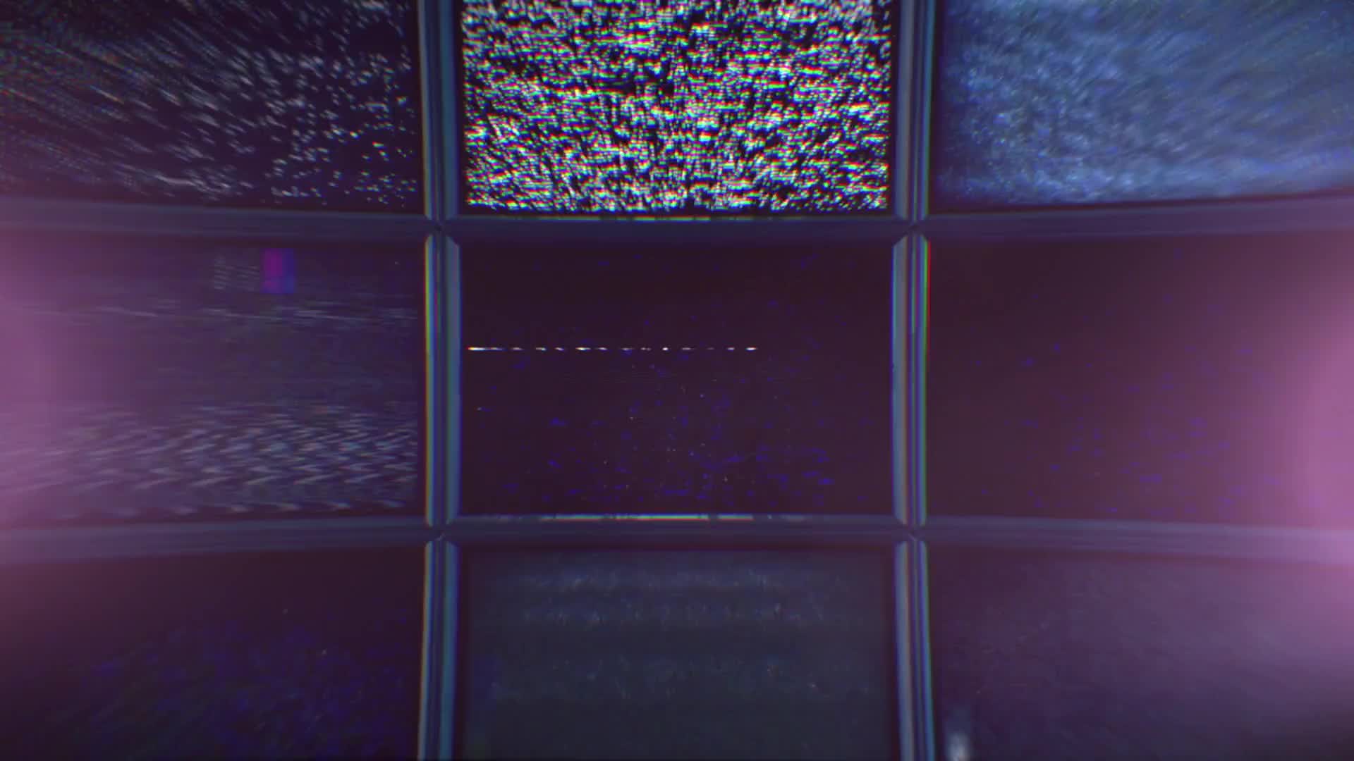 A Wall of TV Screens With Glitch Noise