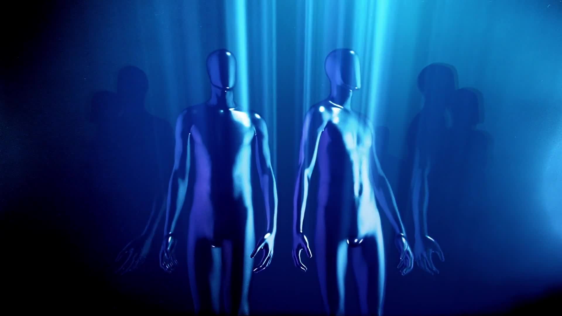 Humanoid Statues In A Circle Turning To Look