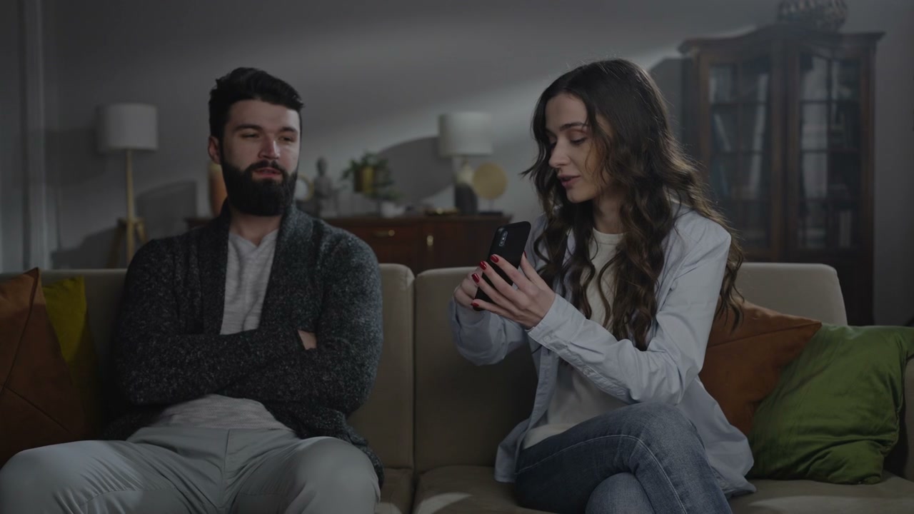 Woman Accusing Man with Smartphone