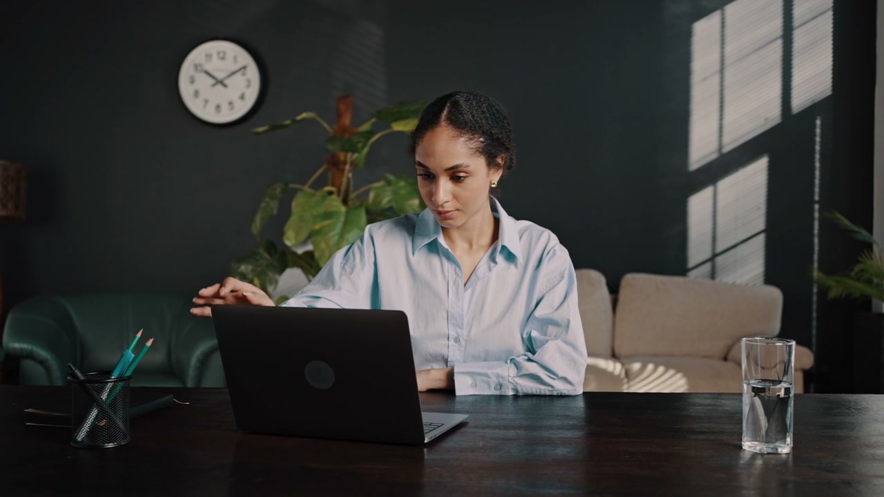 Satisfied Businesswoman Closes Laptop