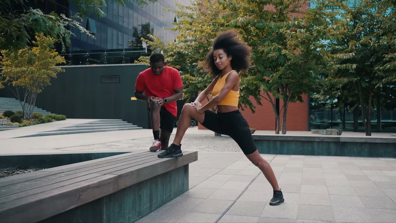 Young Couple Stretching Outdoors