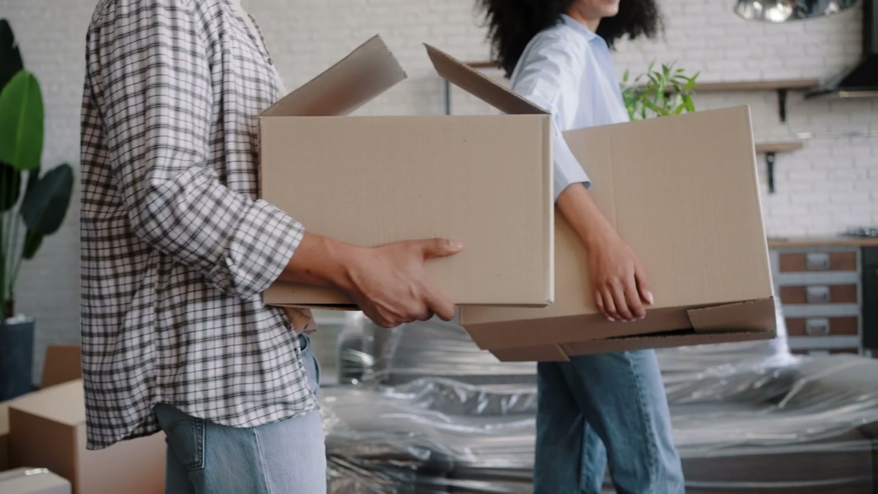 People Carrying Moving Boxes