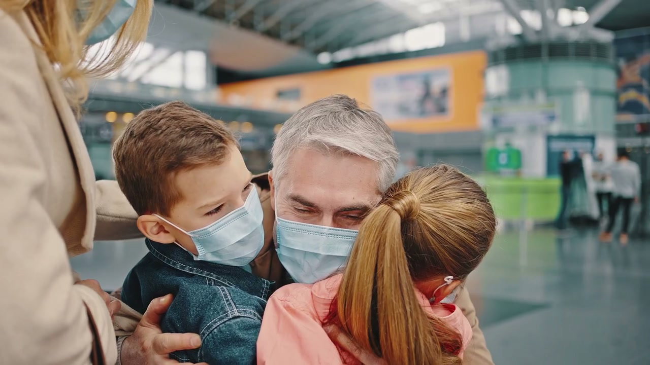 Family Reunion at Airport Wearing Masks