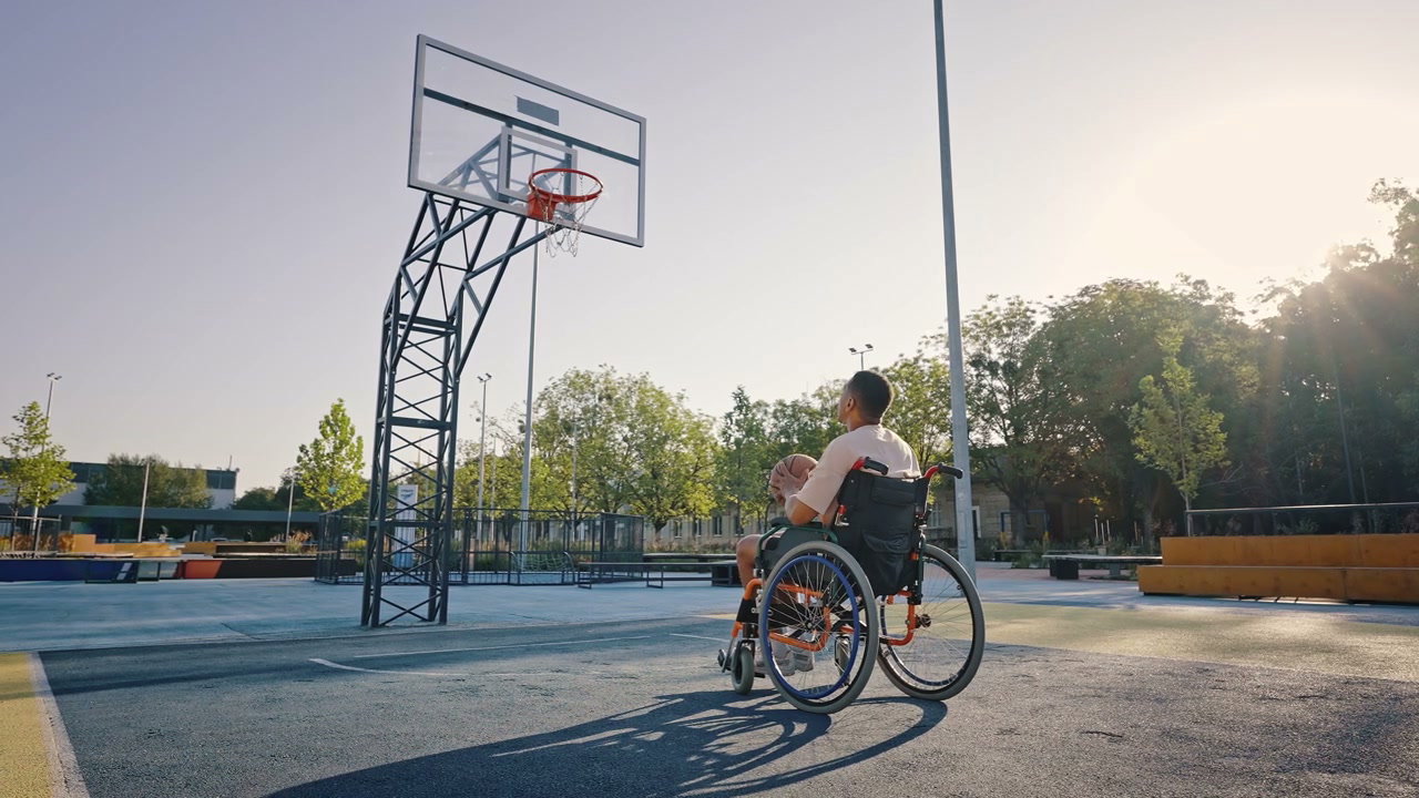 Person in Wheelchair Shoots Basketball