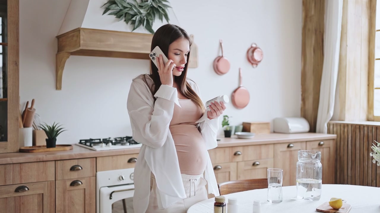 Pregnant Woman Discussing Medication on Phone