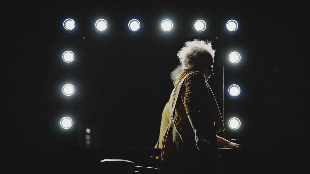Person Leaving Vanity Mirror Backstage