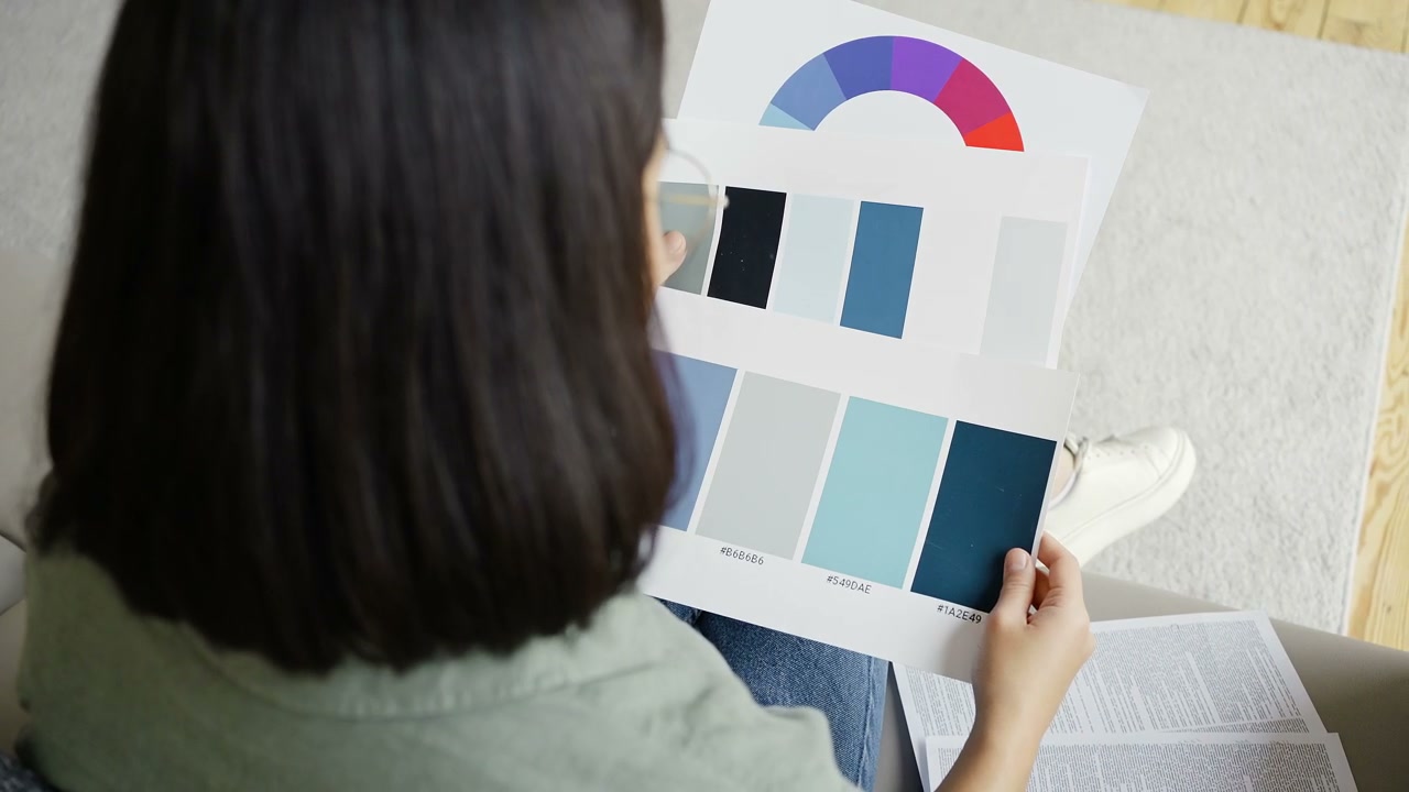 Person Comparing Color Palettes