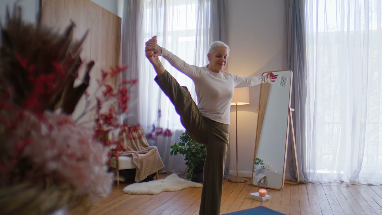 Senior Woman Practicing Yoga Balance Pose