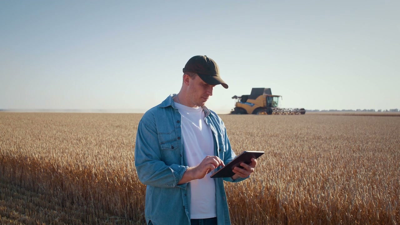 Farmer Using Tablet in Wheat Field