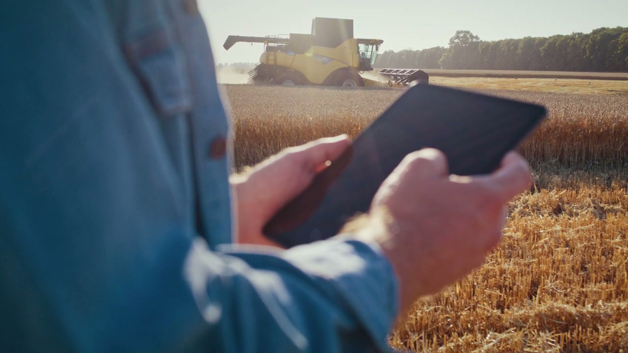 Farmer Using Tablet in Wheat Field