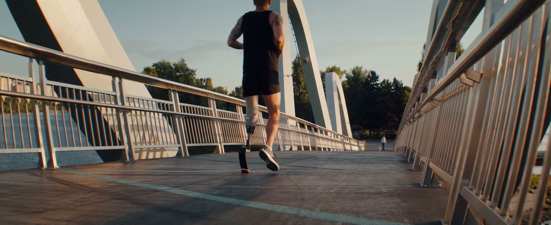 Professional Runner With Running Blade On Bridge