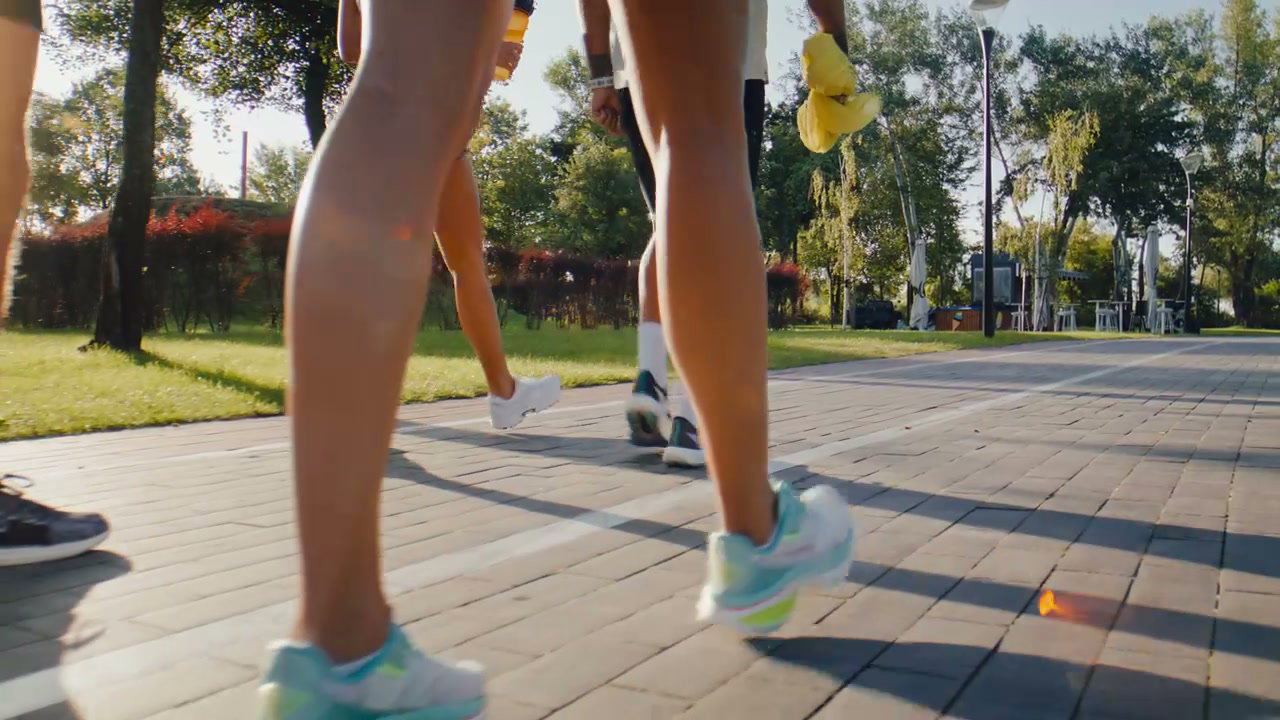 Diverse Group Walking With Prosthetic Leg In Park