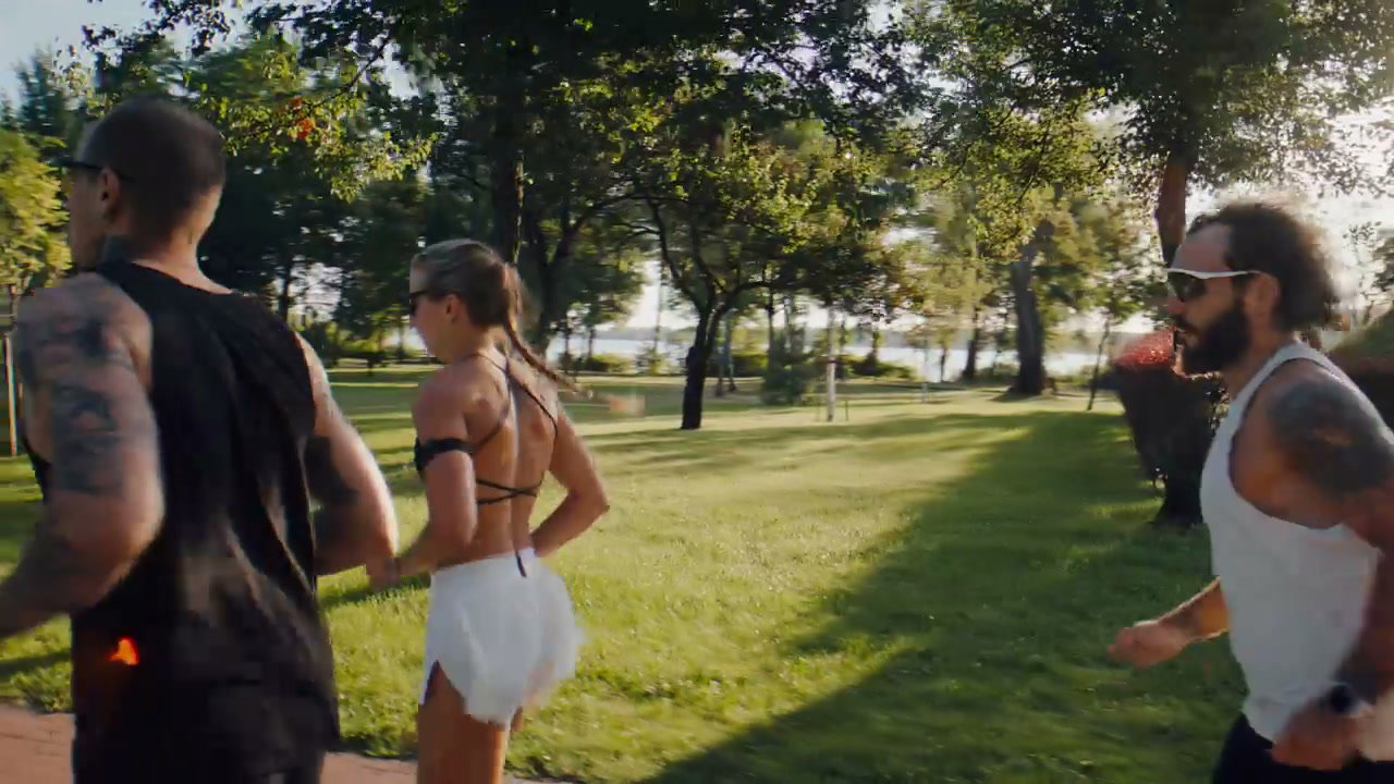 Athletes Running with Prosthetic Leg on Track