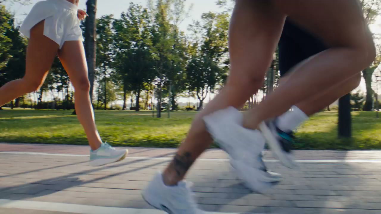 Runners with Prosthetic Leg Exercising in Park