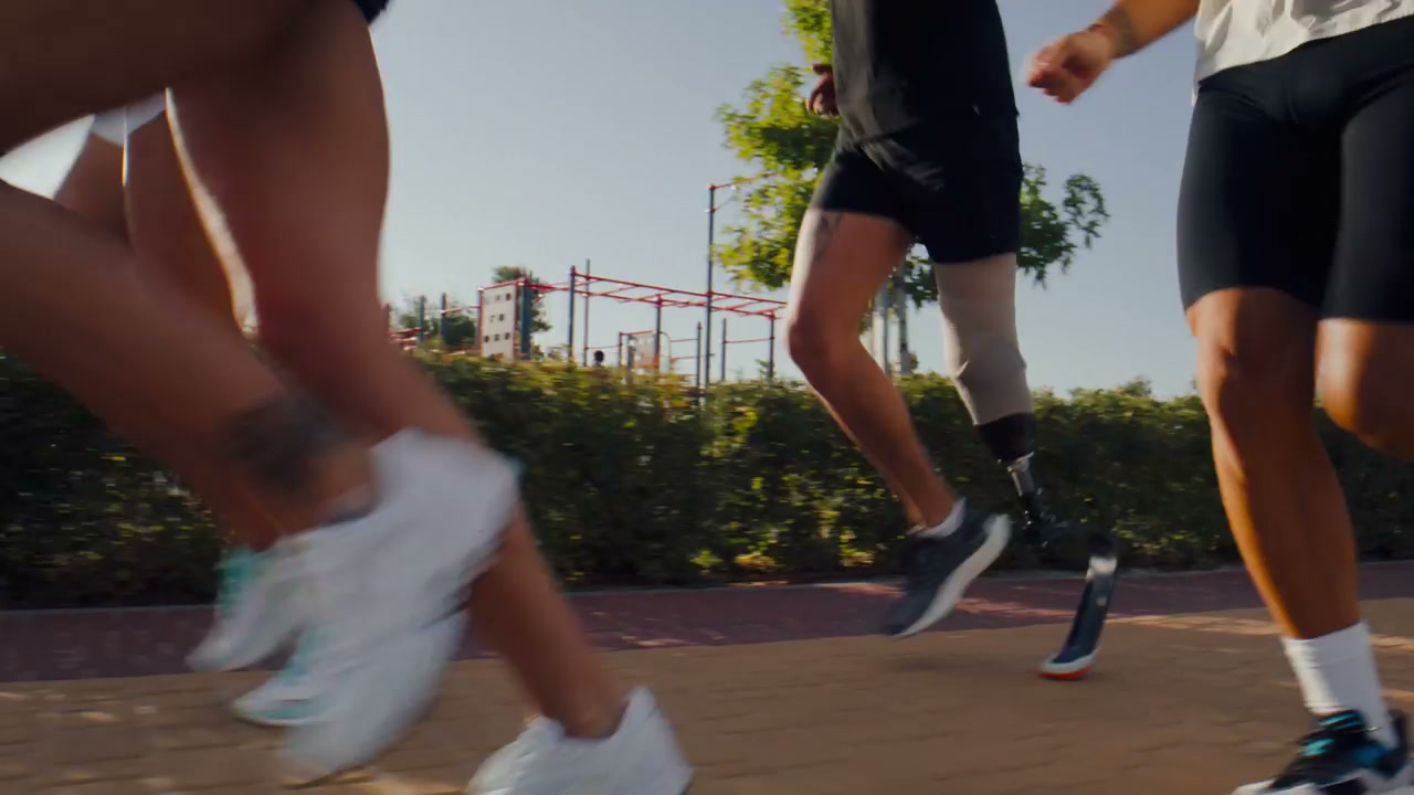 Professional Runners Training Outdoors with Prosthetic Leg
