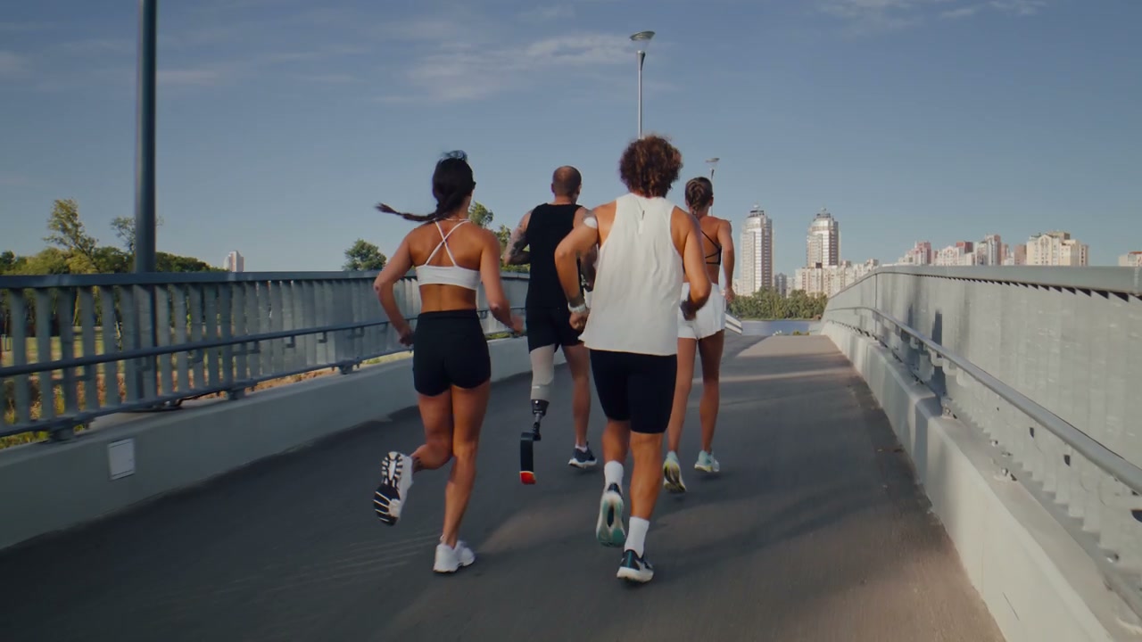 Group of Runners Exercising on a City Bridge