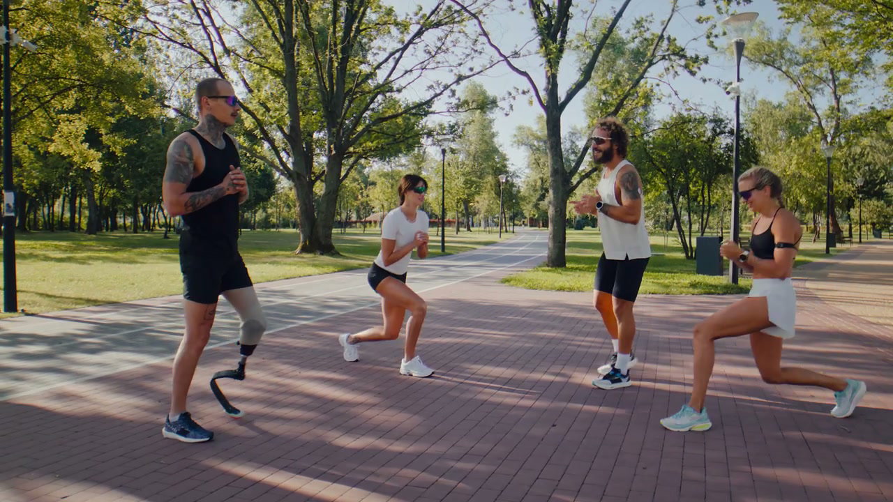 Fitness Group with Prosthetic Leg Doing Lunges