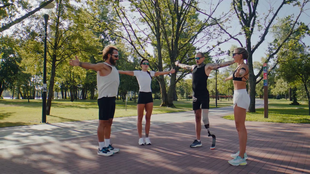 Athletes Stretching Arms in Park