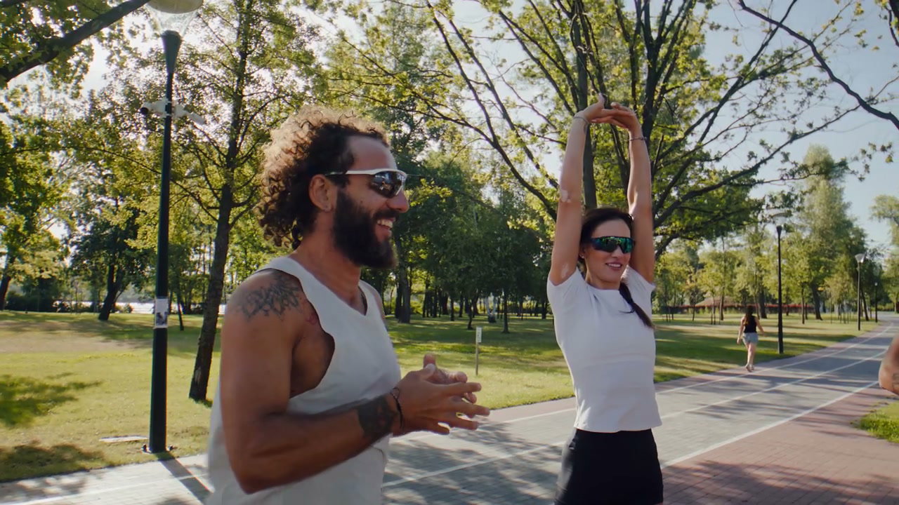 Athletes Stretching in Park