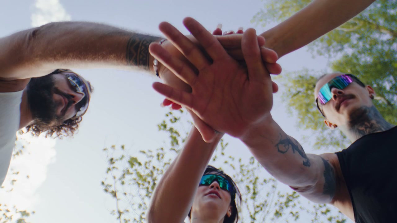 Athletes Huddle and Stack Hands