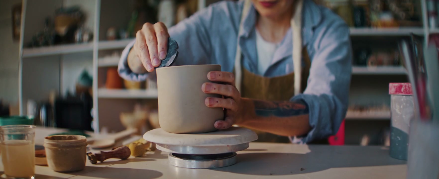 Person Shaping Clay Pot in Ceramic Studio