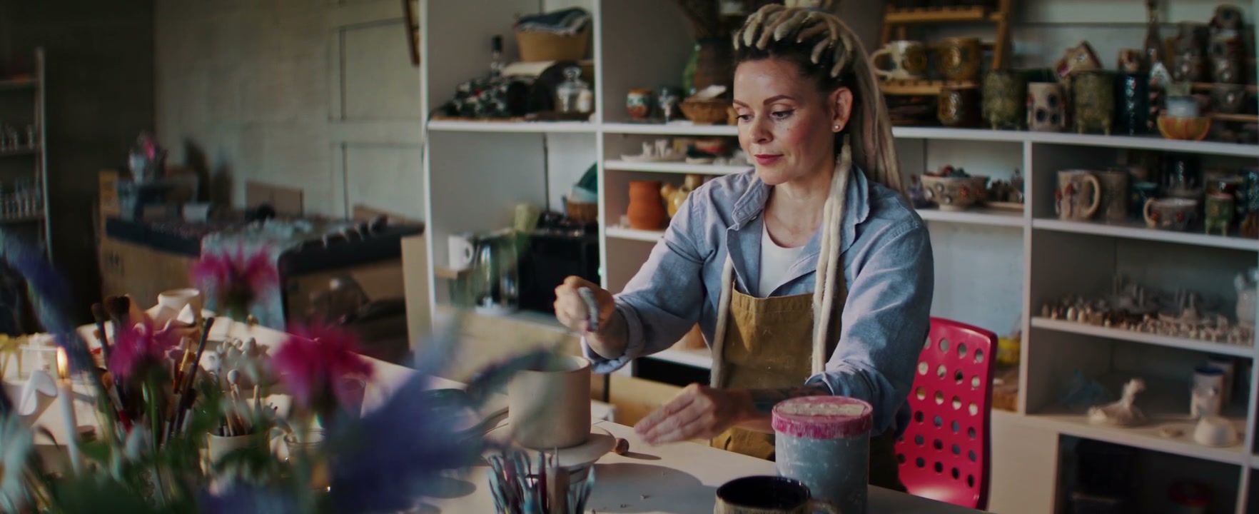 Woman Shaping Clay Pot in Ceramic Studio
