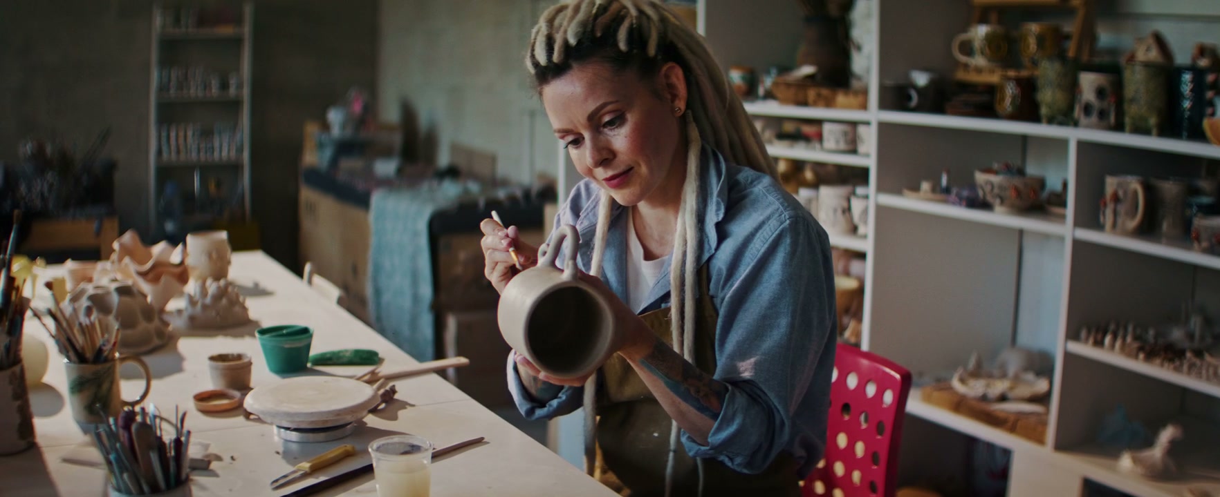 Woman Crafting Mug in Ceramic Studio