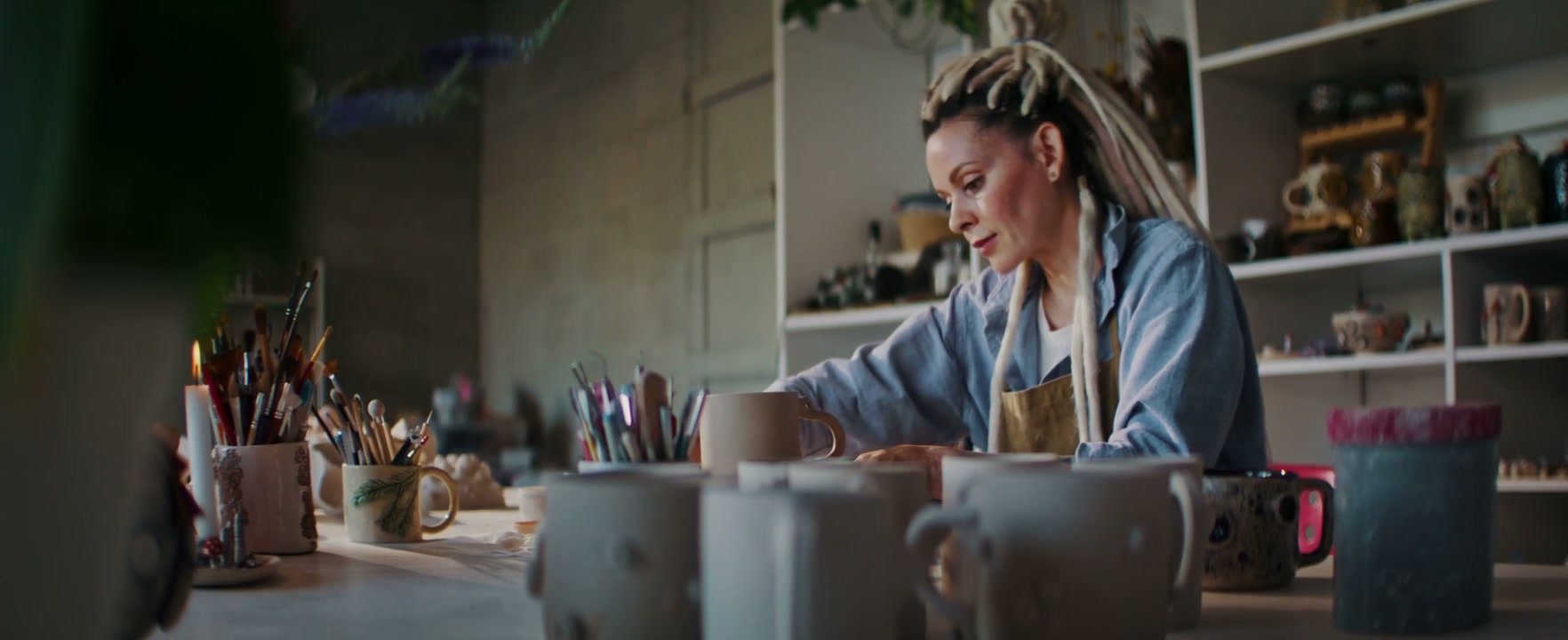 Ceramic Artist Decorating Clay Mug
