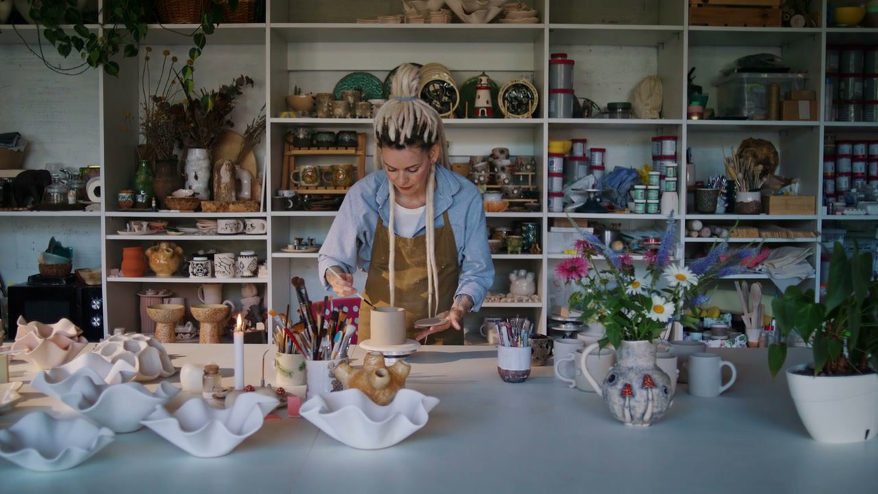 Ceramic Artist Crafting Pottery in Studio