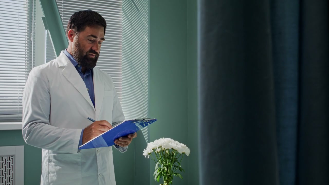Doctor Taking Notes on Clipboard in Hospital