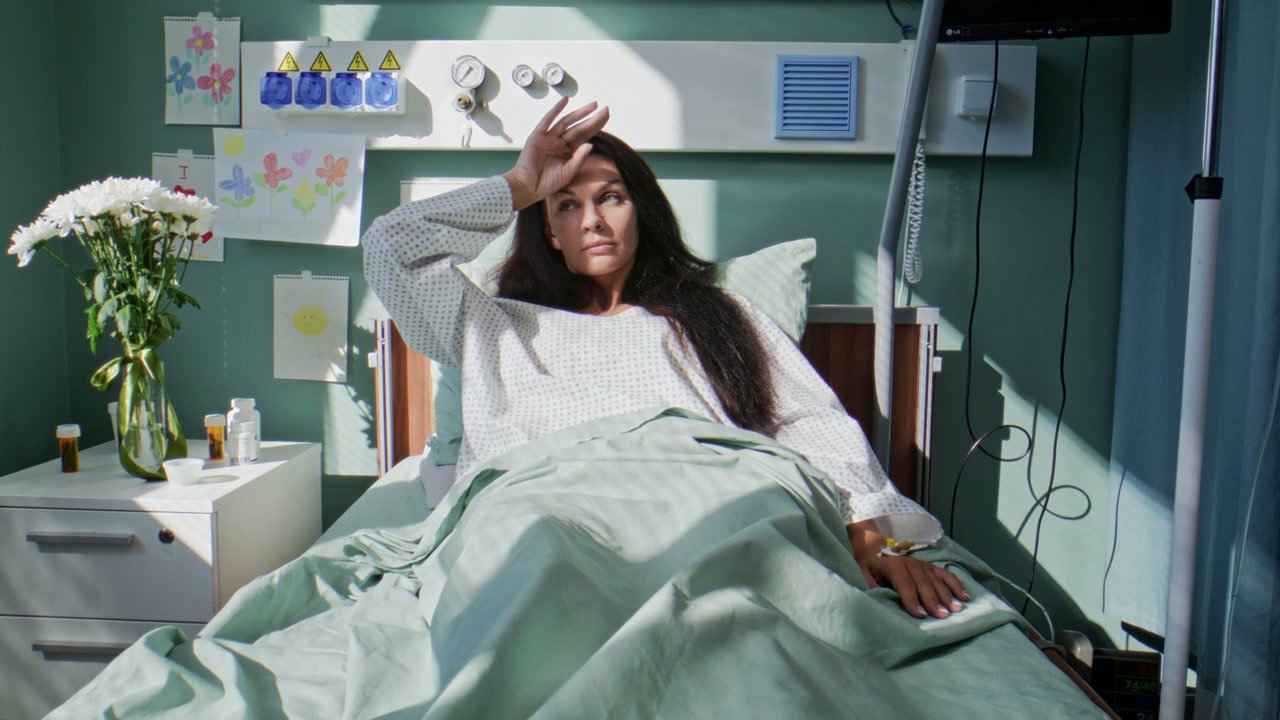 Woman Experiencing Discomfort in Hospital Bed