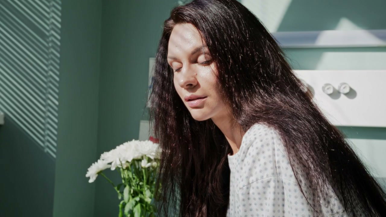 Thoughtful Mother in Hospital Room