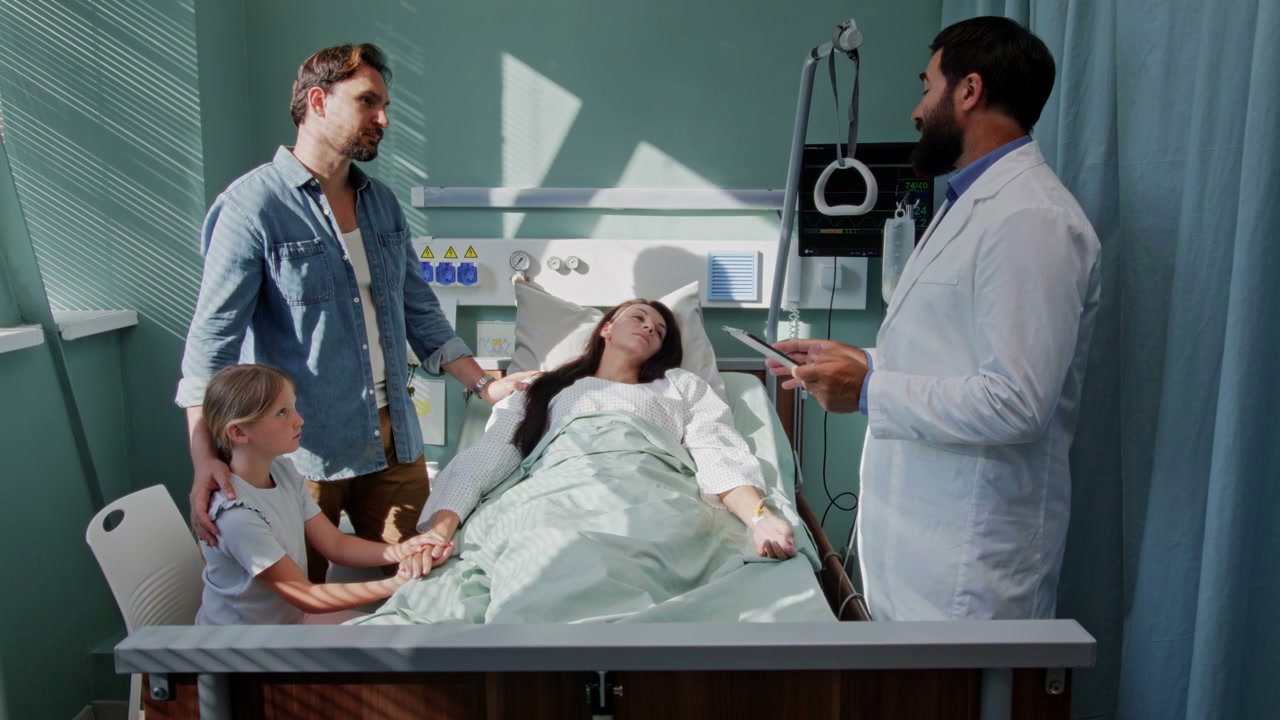 Family Comforting Mother in Hospital Bed