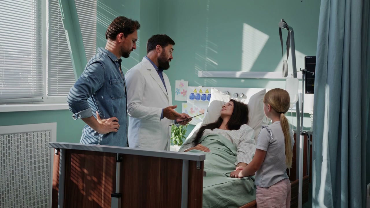 Doctor Explains to Family in Hospital Room