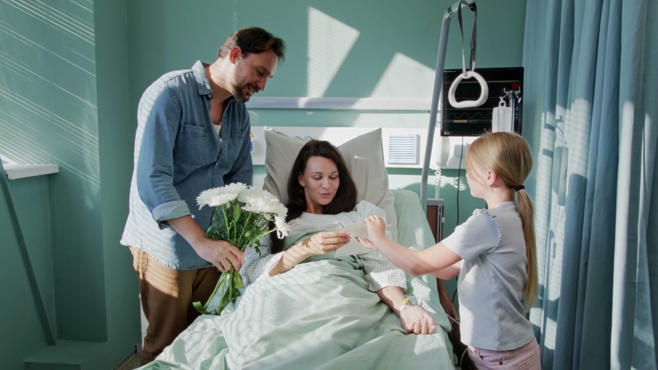 Family Visit Woman in Hospital Room