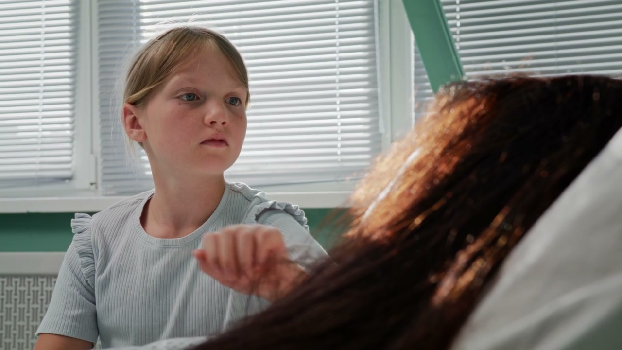 Young Girl Visiting Parent in Hospital
