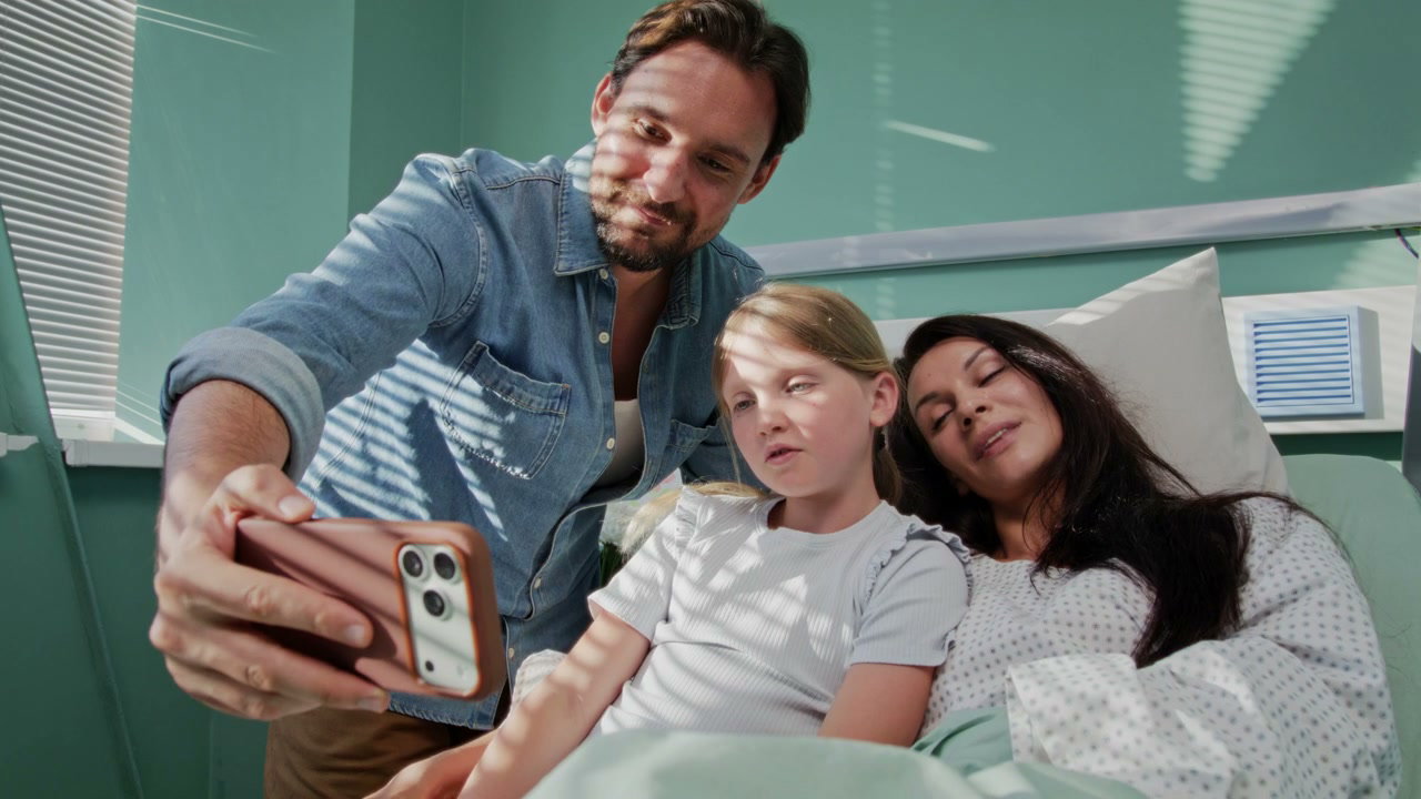 Family Taking Selfie in Hospital Room