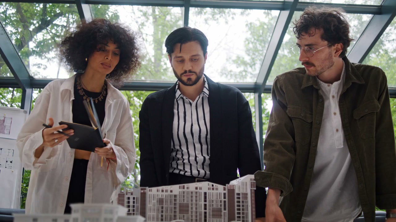 Architects Discussing Building Model