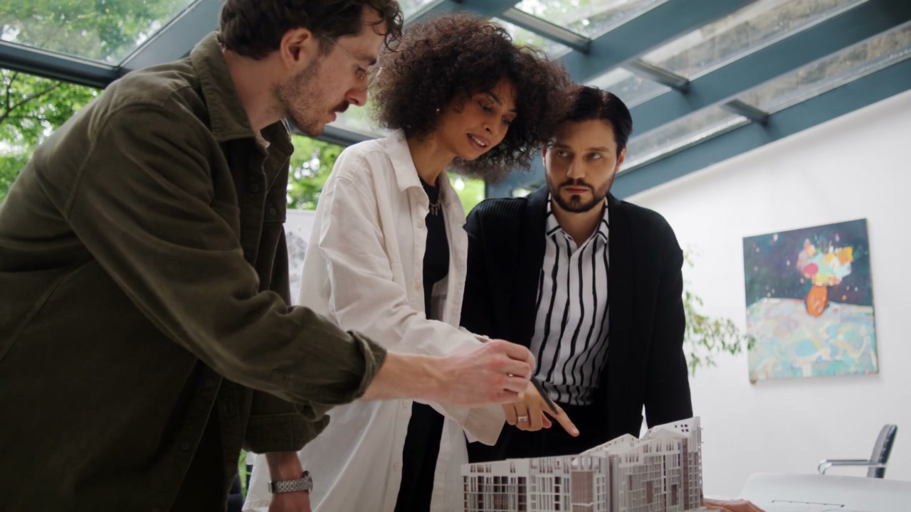 Architects Discussing Building Model