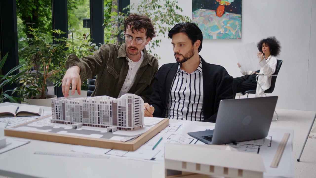 Architects Reviewing Building Model