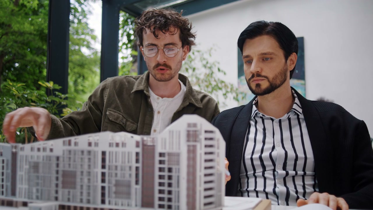 Architects Discussing Building Model