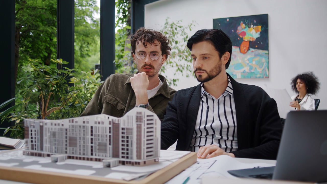 Architects Discussing Building Model