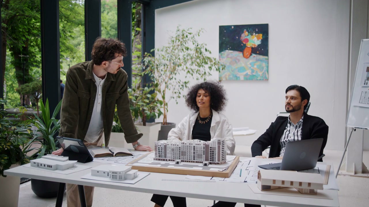 Architectural Team Discussing Building Model
