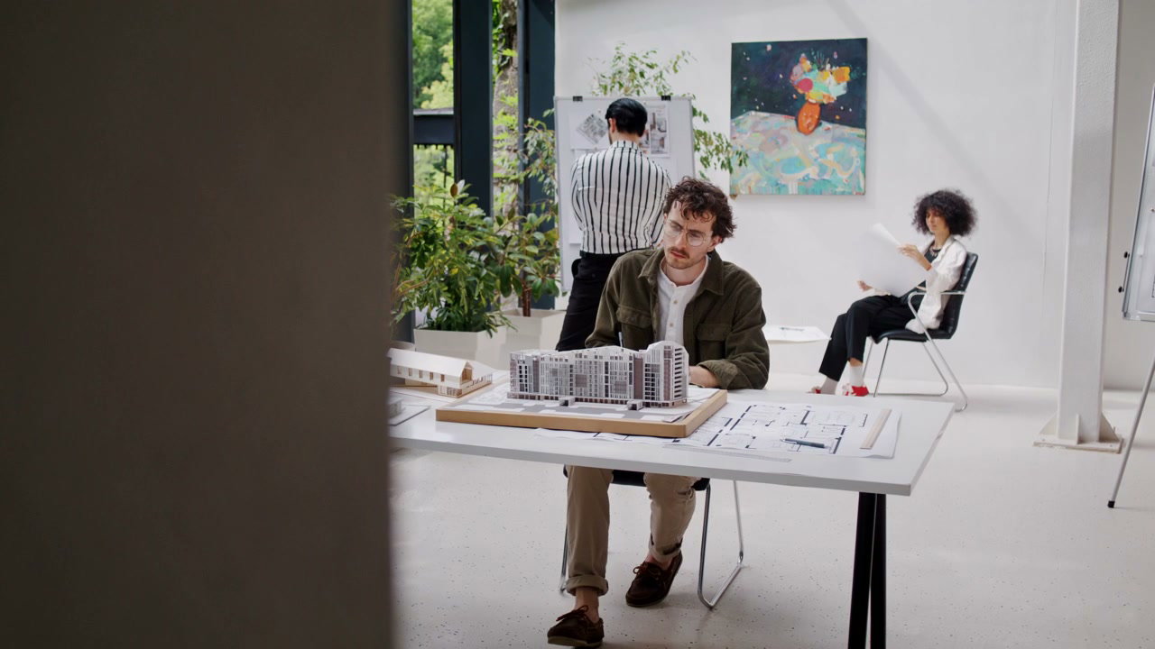 Architect Examining Building Model