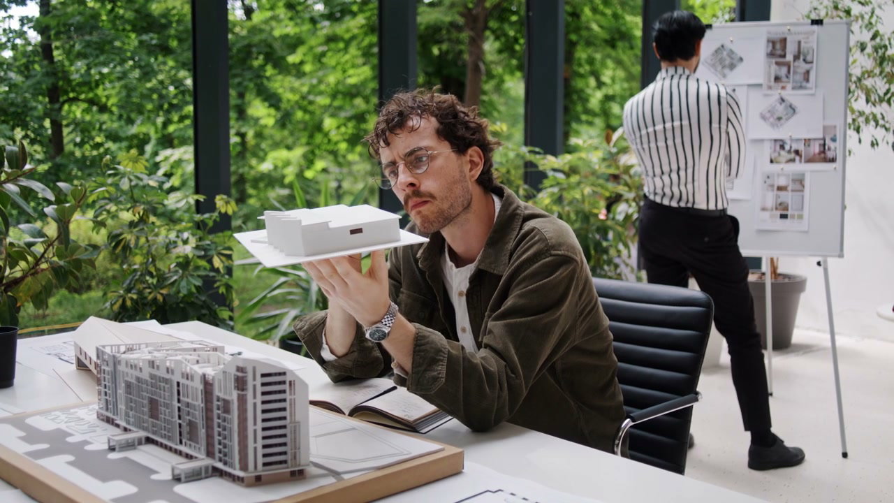 Architect Examining Building Model