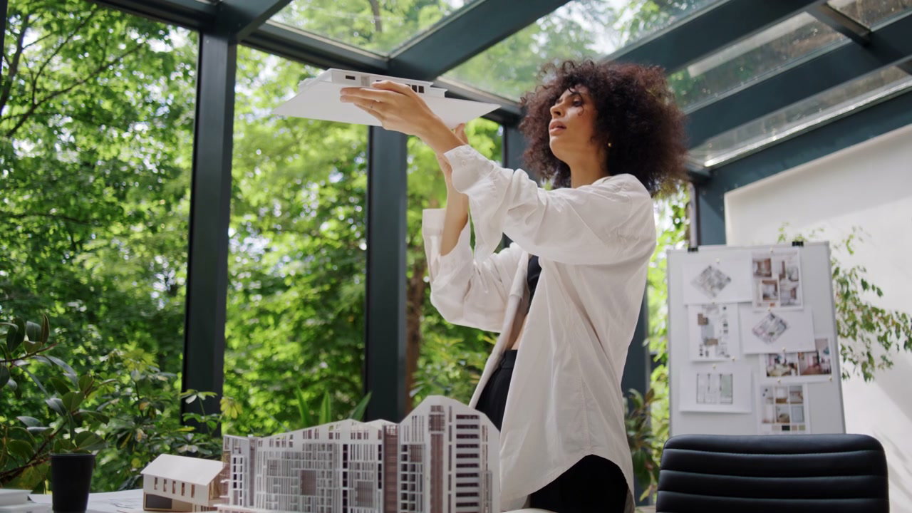 Architect Examining Building Model