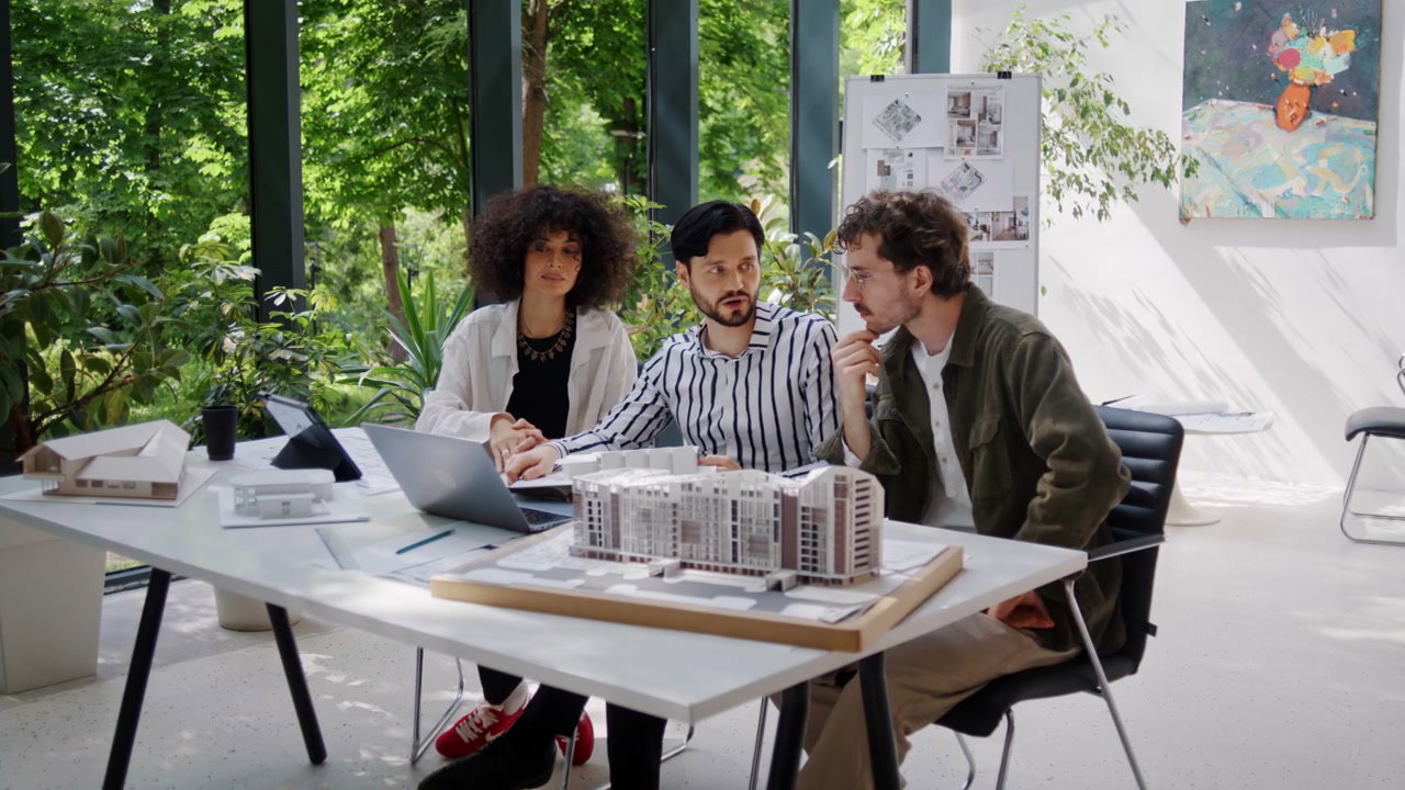 Architects Discussing Building Model
