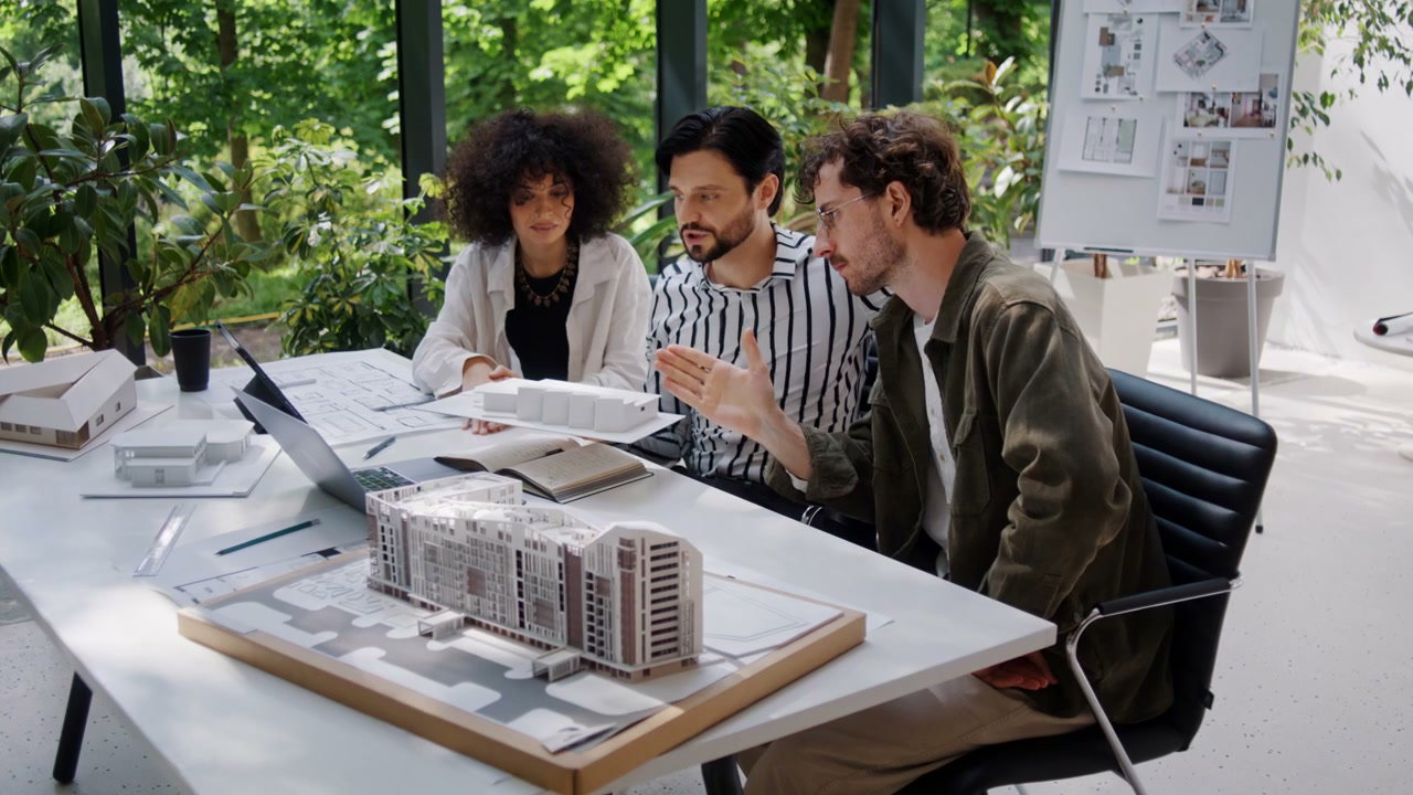Team of Architects Discussing Building Plans