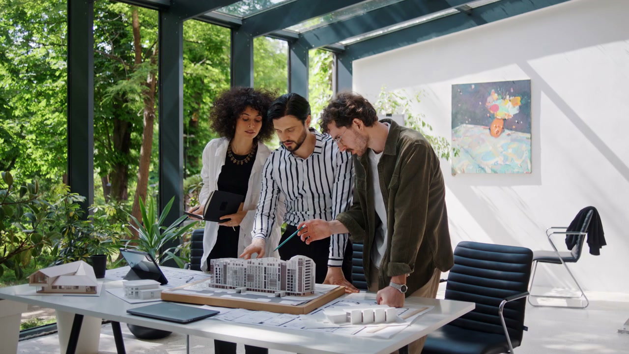 Architects Discussing Building Model In Office