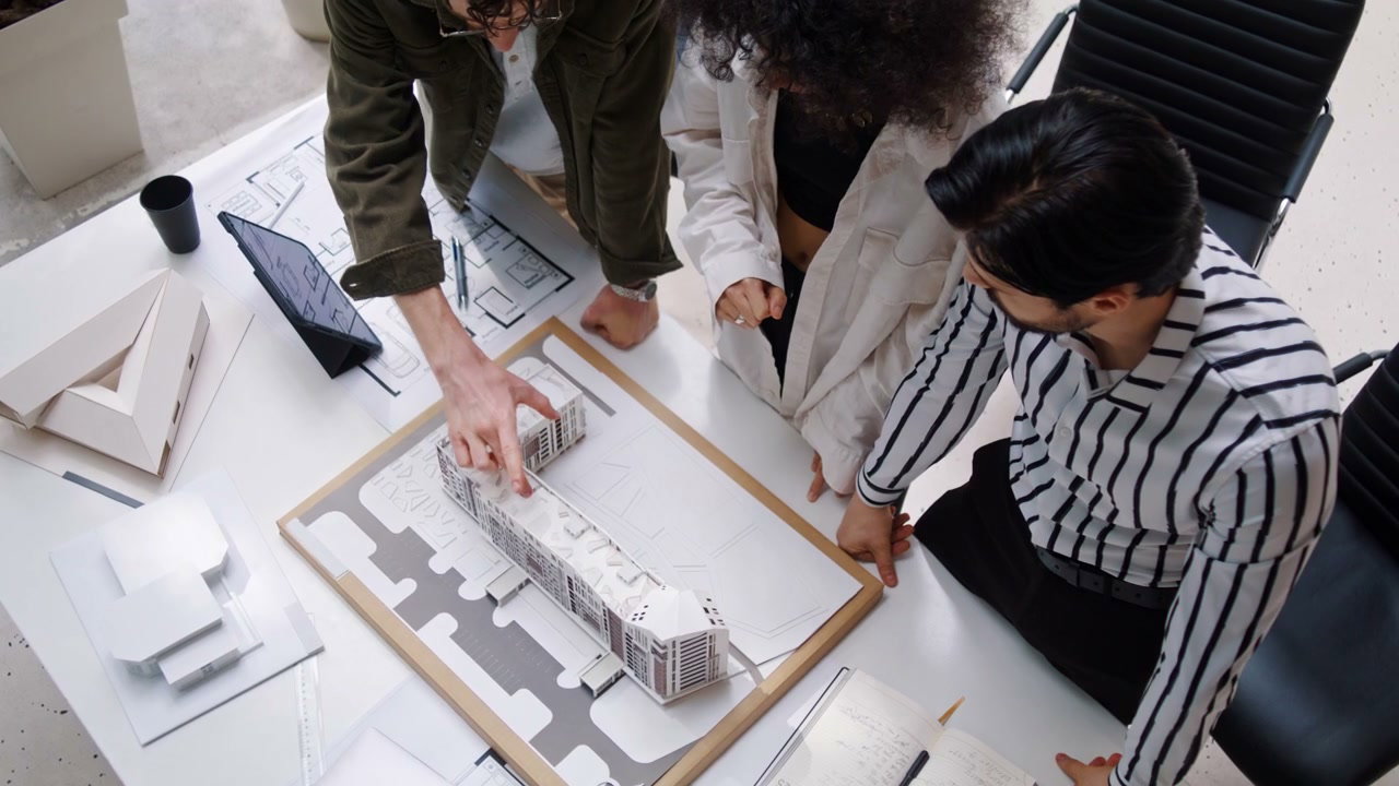 Architects Discussing Building Model